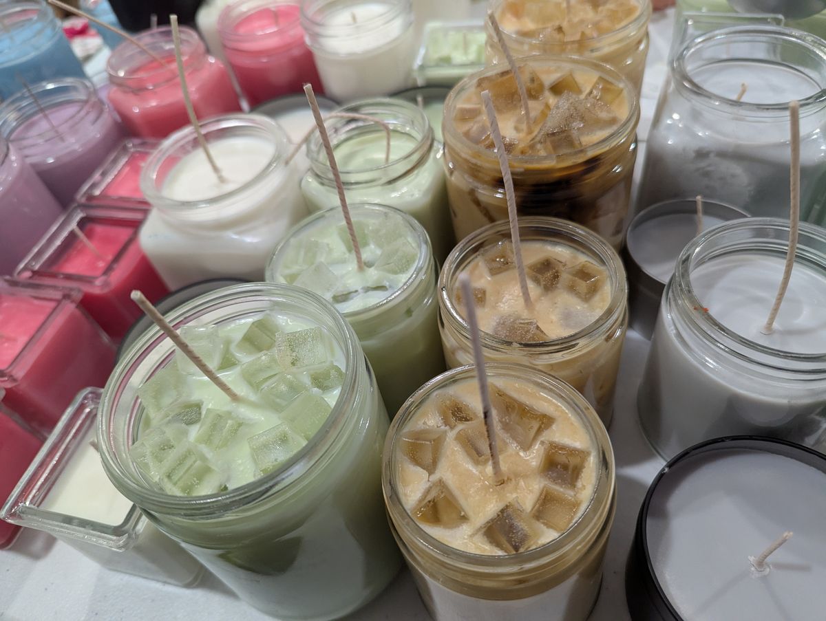 Handmade Sippin' Sunshine candles being carefully prepared in small batches